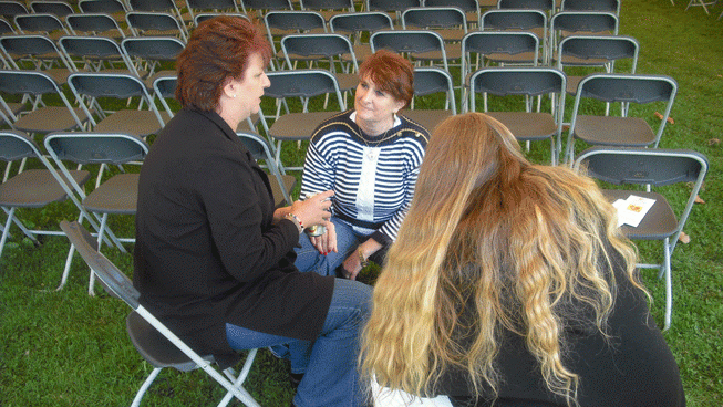 Rev. Marikka Preusser ministering to ladies
